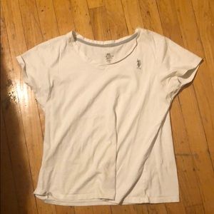 A white polo short sleeve shirt